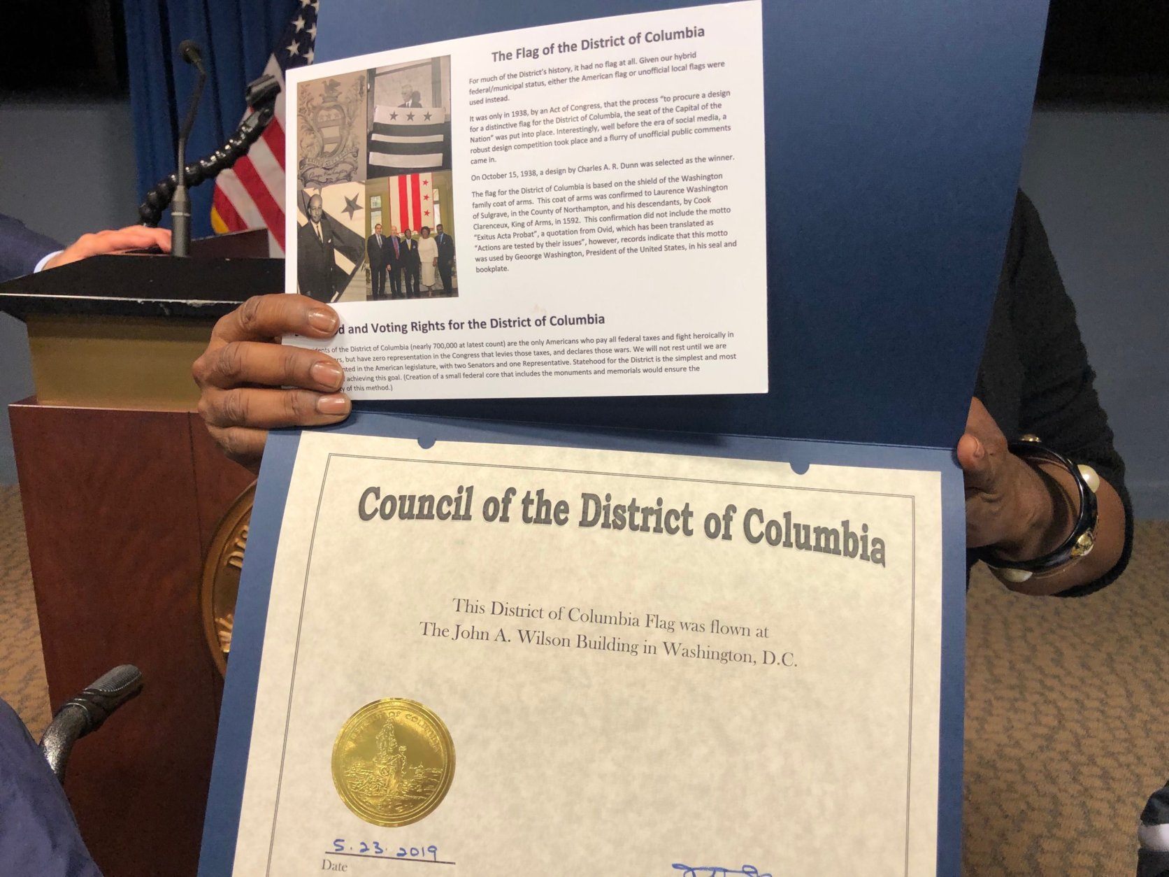 Leroy Tonic, 95, receives a certificate honoring his service in World War II and his work in the D.C. government. (WTOP/Kristi King)