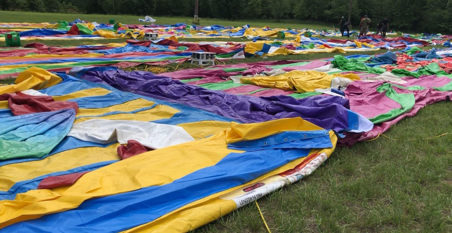 It started out flattened, and taking up a lot of space on a field near Rosecroft Raceway. But then the compressors kicked in. (WTOP/Kristi King)