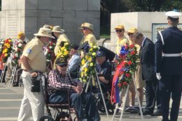 Veterans remember their fallen friends at the World War II Memorial on the National Mall on Monday, May 27, 2019. (WTOP/Keara Dowd)