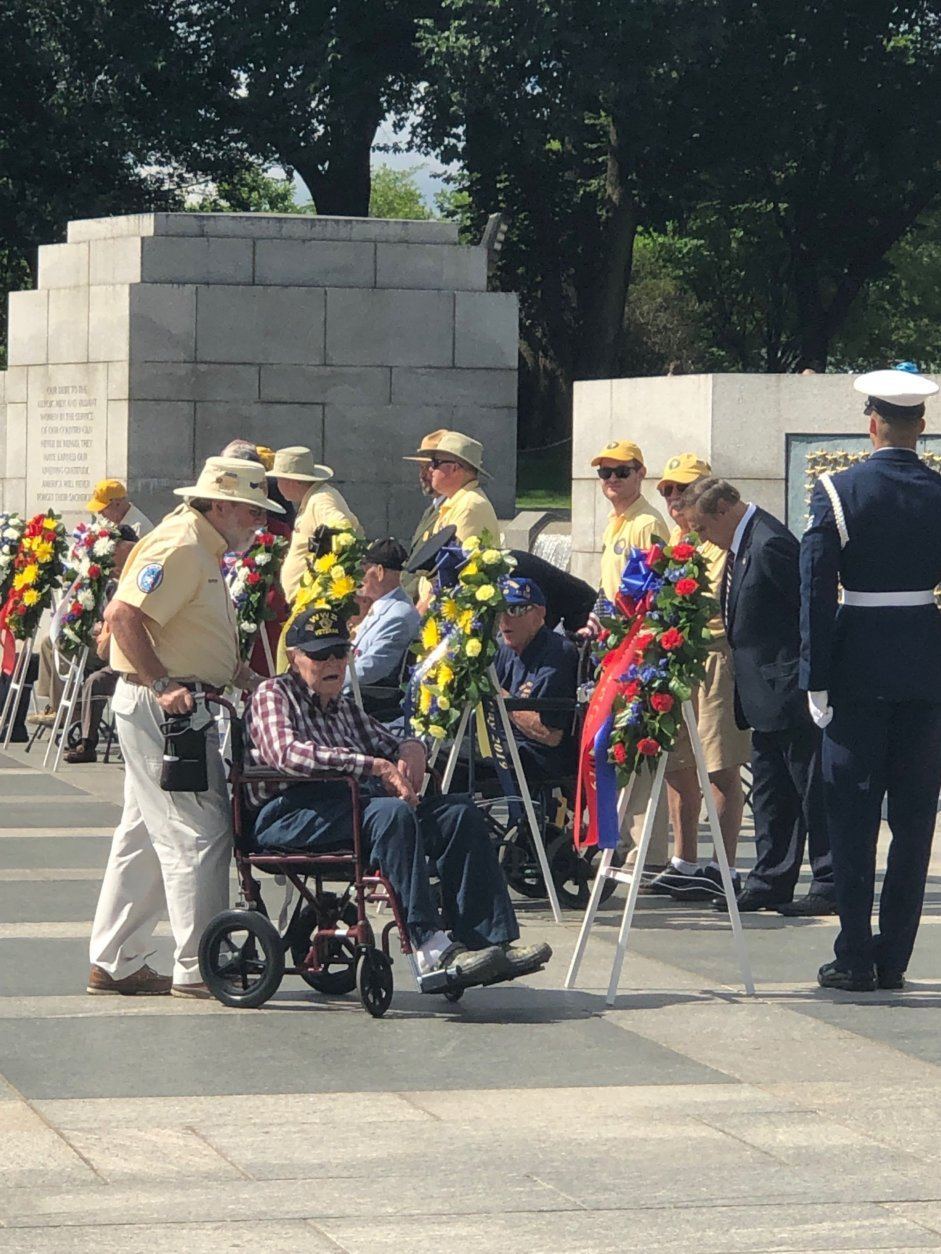 Veterans remember their fallen friends at the World War II Memorial on the National Mall on Monday, May 27, 2019. (WTOP/Keara Dowd)