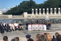 A brass quintet from the U.S. Army band Pershing’s Own plays at the memorial on Monday, May 27, 2019. (WTOP/Keara Dowd)