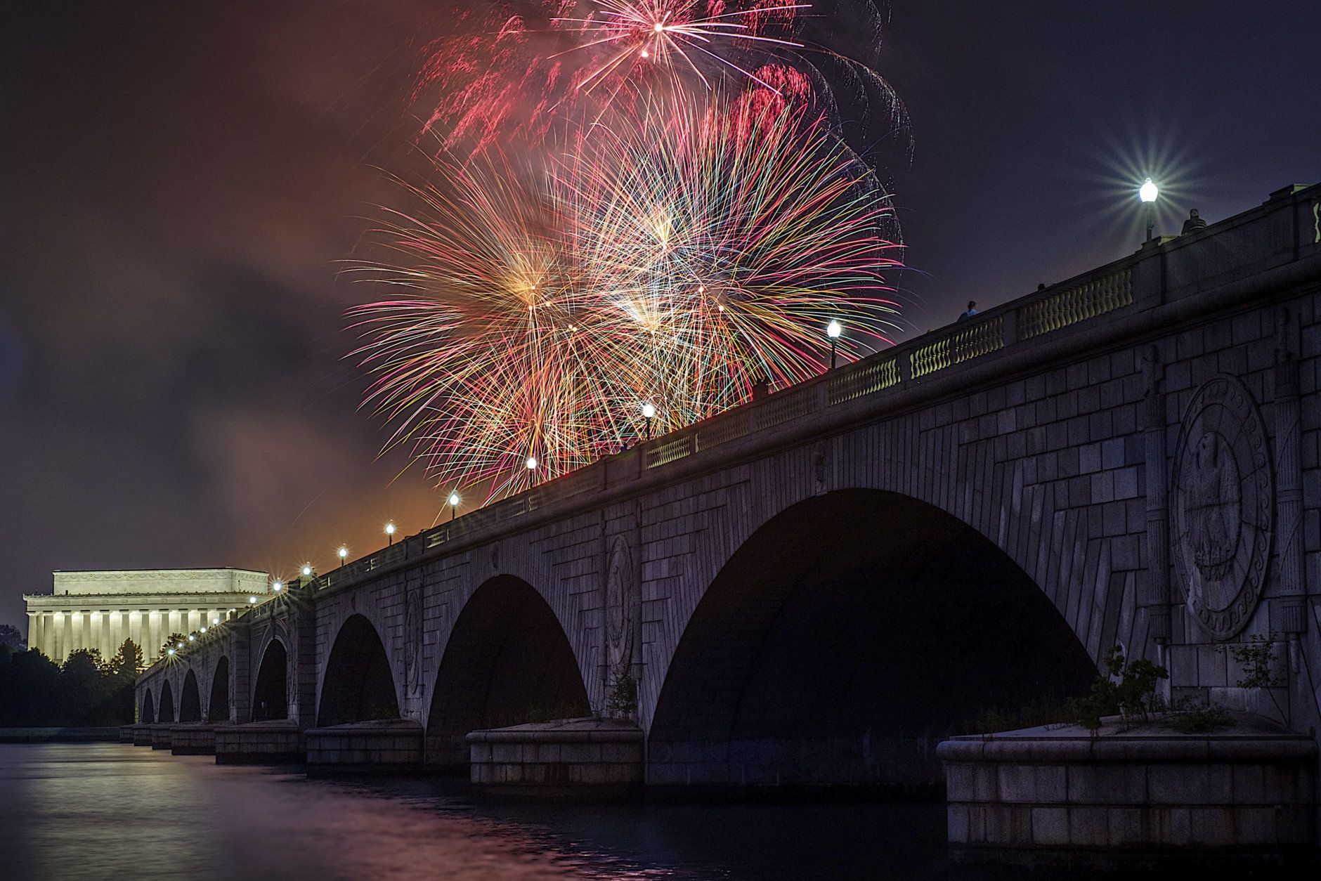 Fireworks burst over the Memorial Bridge and Lincoln Memorial during Independence Day celebrations on the National Mall in Washington, Tuesday, July 4, 2017. (AP Photo/J. David Ake)