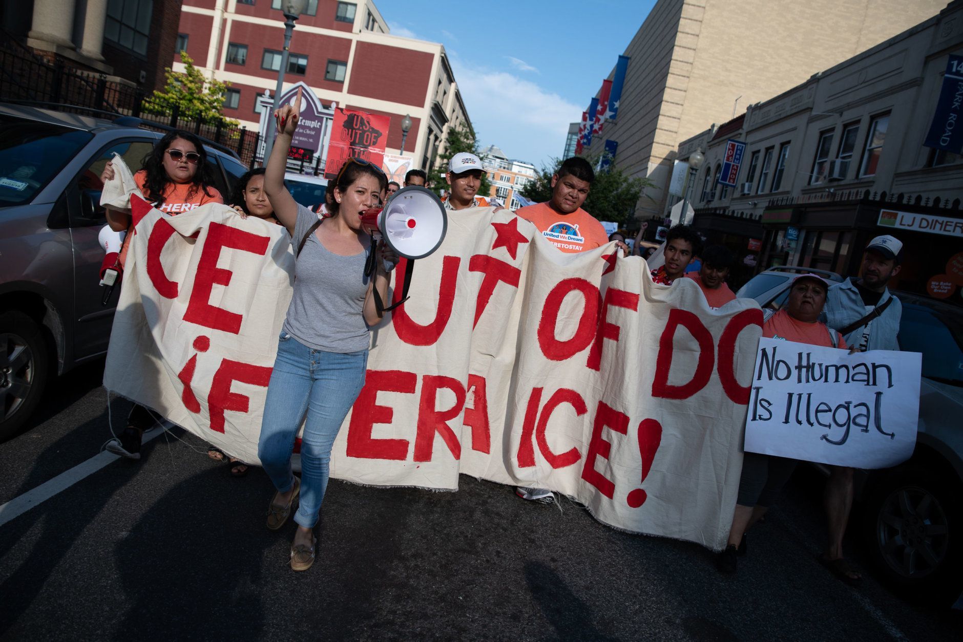 D.C. immigrant advocacy groups and their allies rallied in Columbia Heights and Adams Morgan on June 29, 2019, demanding Mayor Muriel Bowser and the D.C. Council enforce the city's status as a "sanctuary city" and not cooperate with federal law enforcement in detaining undocumented migrants. (WTOP/Alejandro Alvarez)