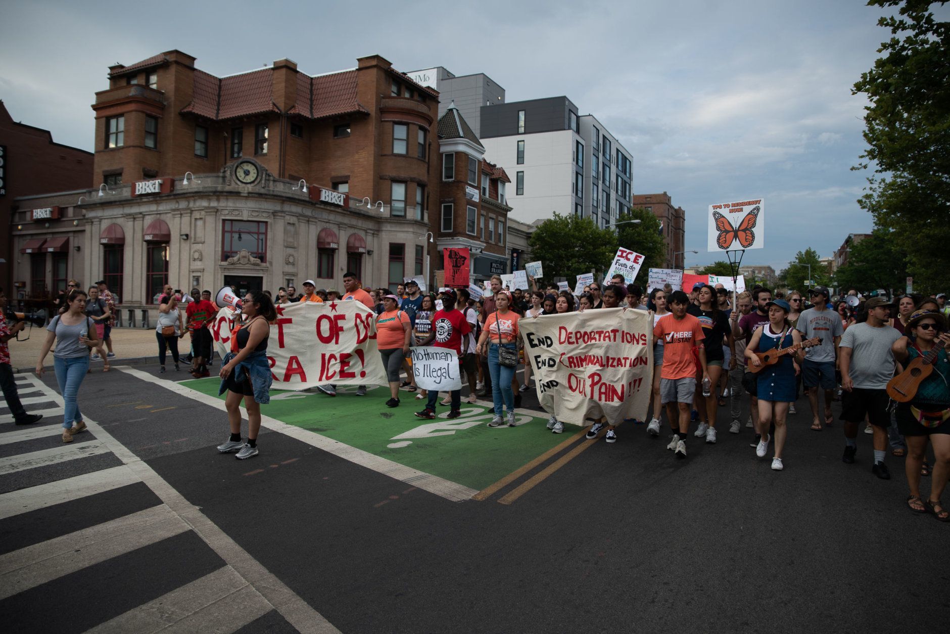D.C. immigrant advocacy groups and their allies rallied in Columbia Heights and Adams Morgan on June 29, 2019, demanding Mayor Muriel Bowser and the D.C. Council enforce the city's status as a "sanctuary city" and not cooperate with federal law enforcement in detaining undocumented migrants. (WTOP/Alejandro Alvarez)
