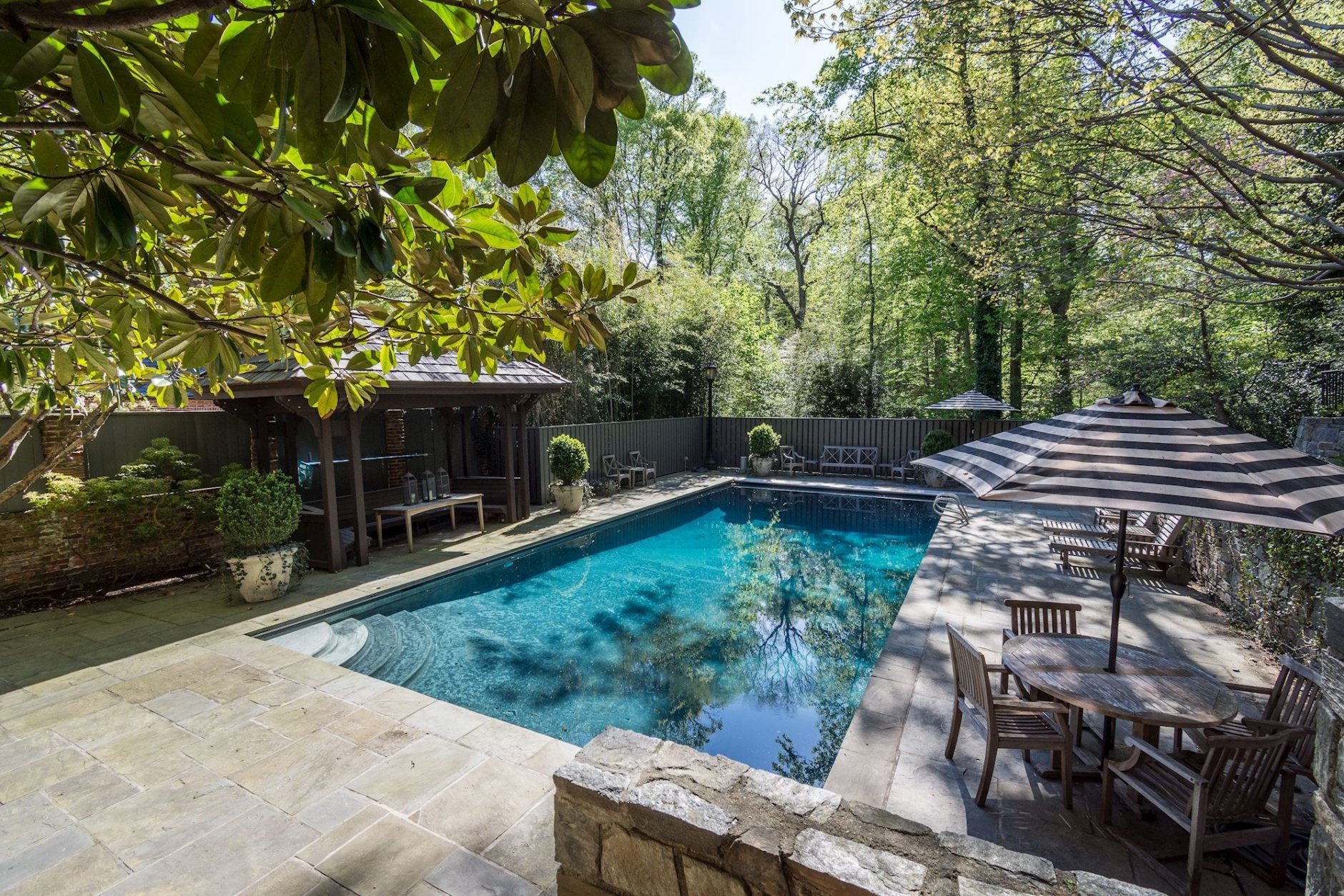 The 8,350-square-foot home includes six bedrooms, six full and two half-baths, seven fireplaces, a wine cellar, catering kitchen, and a 42-foot by 20-foot swimming pool, one of the largest residential swimming pools in the District. (Credit: HLR Partners at Washington Fine Properties)