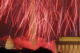 Fireworks light the sky over the U.S. Capitol, left, Washington Monument and Lincoln Memorial in Washington on Wednesday, July 4, 2012, as seen from Arlington, Va. (AP Photo/Alex Brandon)