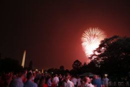 People watch fireworks on the National Mall from the South Lawn of the White House, Wednesday, July 4, 2018, in Washington. (AP Photo/Alex Brandon)