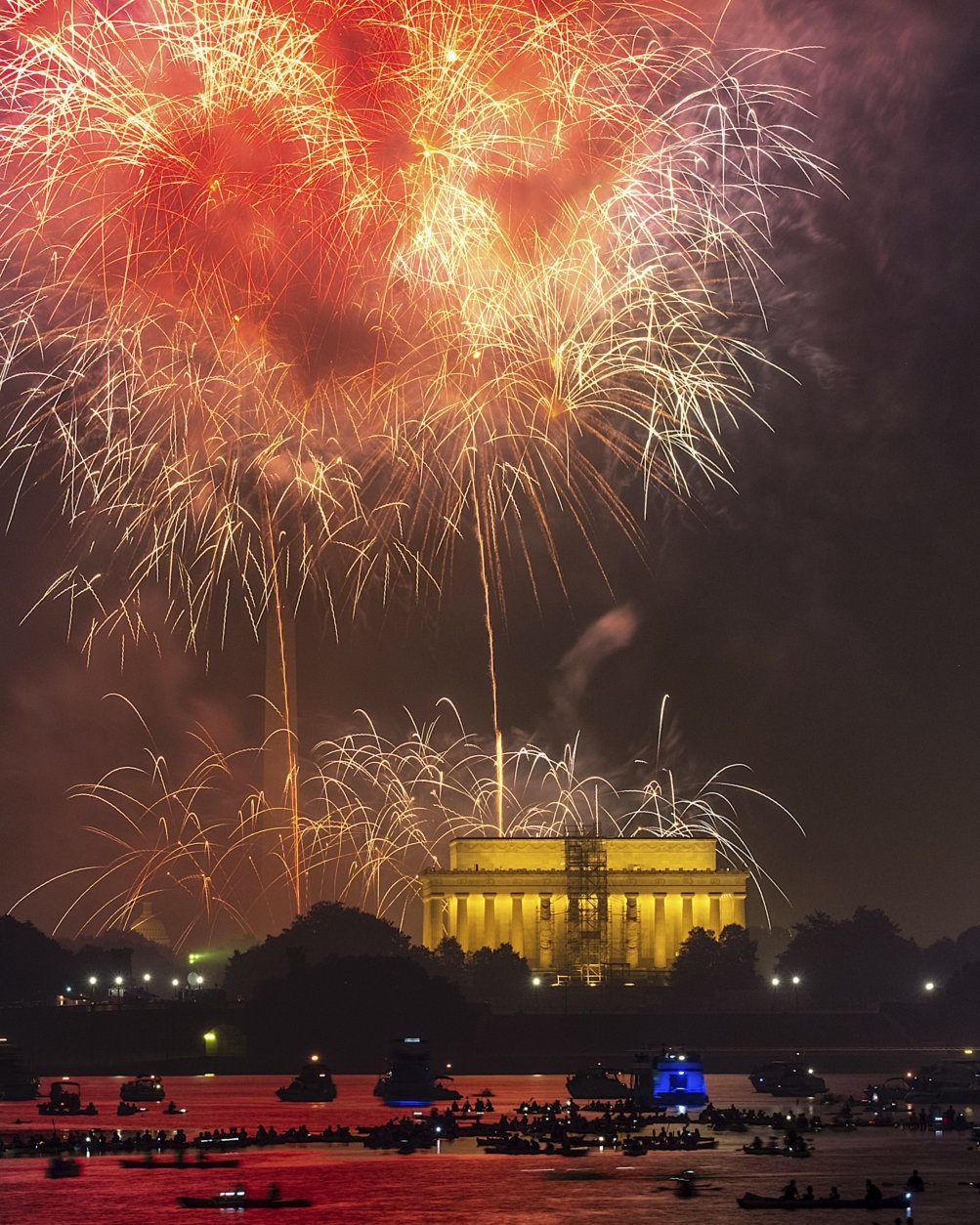 Boaters on the Potomac River in Washington watch the fireworks display on the National Mall Wednesday, July 4, 2018, in celebration of Independence Day. (AP Photo/J. David Ake)
