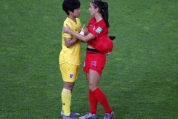 United States' Alex Morgan, right, talks with Thailand goalkeeper Waraporn Boonsing following their the Women's World Cup Group F soccer match between the United States and Thailand at the Stade Auguste-Delaune in Reims, France, Tuesday, June 11, 2019. The US defeated Thailand 13-0.(AP Photo/Francois Mori)