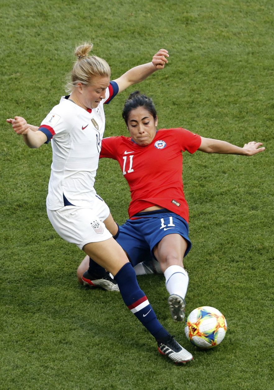 United States' Emily Sonnett vies for the ball with Chile's Yessenia Lopez, right, during the Women's World Cup Group F soccer match between the United States and Chile at the Parc des Princes in Paris, Sunday, June 16, 2019. (AP Photo/Thibault Camus)