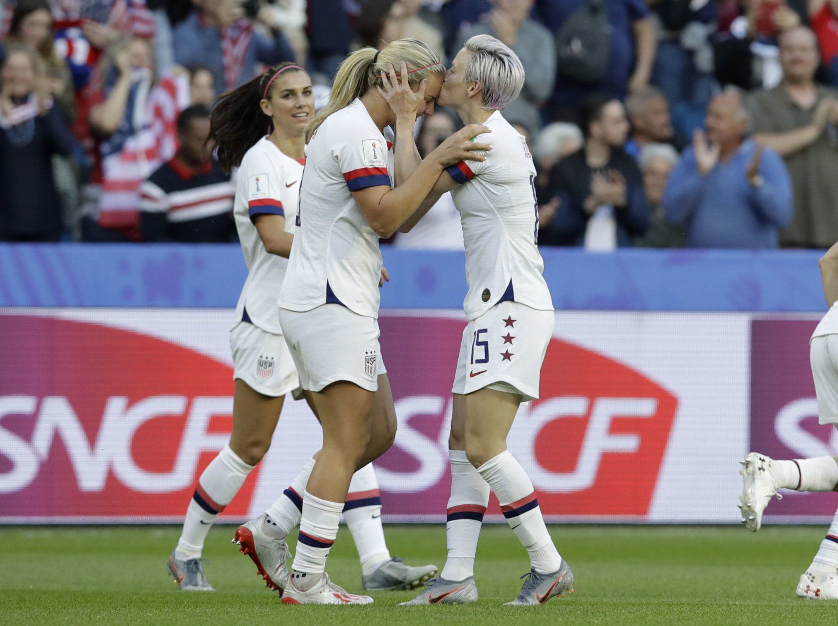 United States' Megan Rapinoe, right, kisses teammate and goal scorer Lindsey Horan during the Women's World Cup Group F soccer match between Sweden and the United States at Stade Océane, in Le Havre, France, Thursday, June 20, 2019. (AP Photo/Alessandra Tarantino)