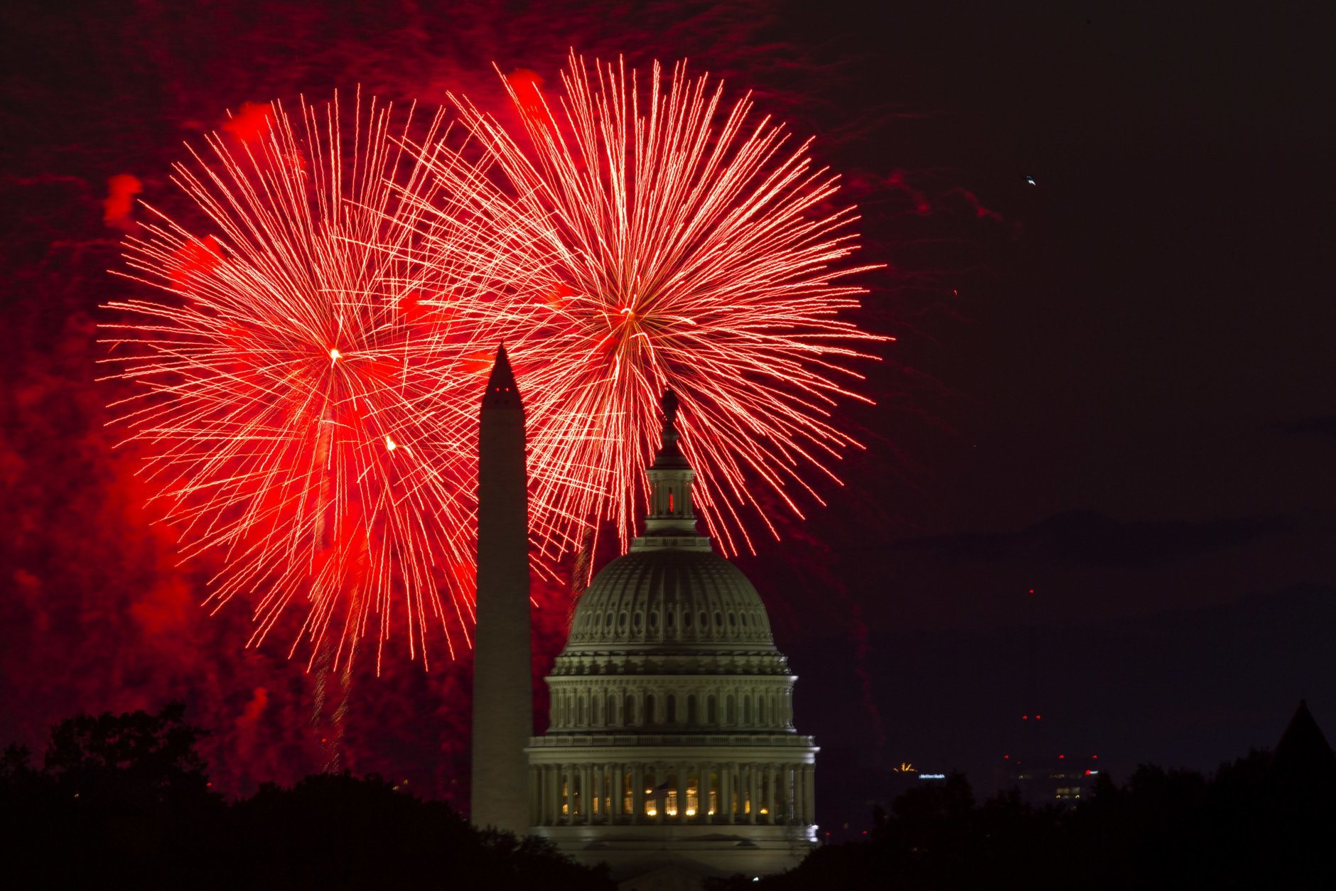 Fireworks illuminate the sky over the U.S. Capitol building and the Washington Monument during Fourth of July celebrations, on Friday, July 4, 2014, in Washington. (AP Photo/Evan Vucci)