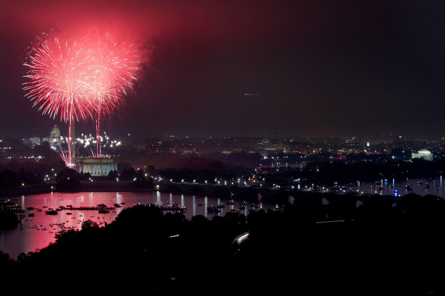 Fireworks explode over the National Mall for Fourth of July celebrations in Washington, photographed from Arlington, Va., on Saturday, July 4, 2015. (AP Photo/Jacquelyn Martin)