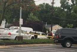 Police work at the scene of a gun store burglary on Randolph Road in Rockville on June 13, 2019. (WTOP/John Domen)