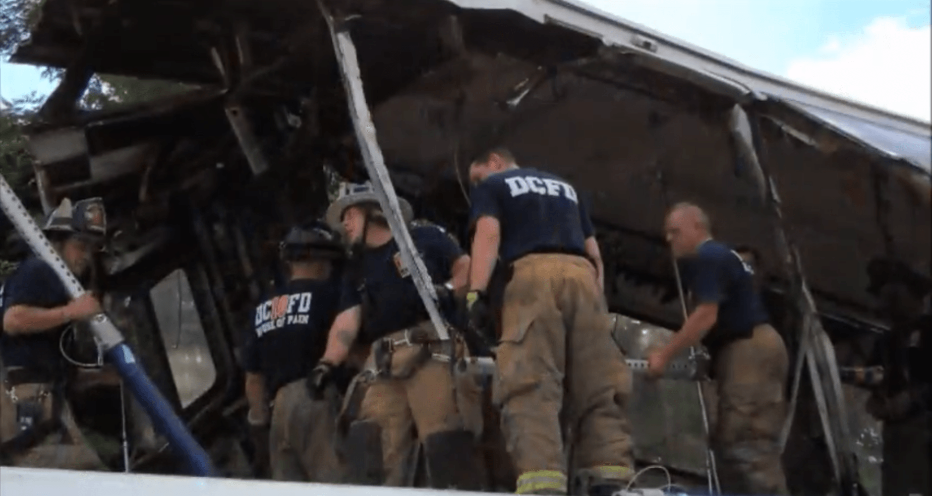 A screenshot from a DC Fire and EMS documentary shows Tony Carroll's crew on top of one of the railcars that crashed on the Red Line in 2009. (Courtesy DC Fire and EMS)