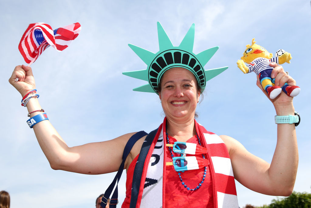 REIMS, FRANCE - JUNE 24: A USA fan poses for a photo outside the stadium prior to the 2019 FIFA Women's World Cup France Round Of 16 match between Spain and USA at Stade Auguste Delaune on June 24, 2019 in Reims, France. (Photo by Robert Cianflone/Getty Images)