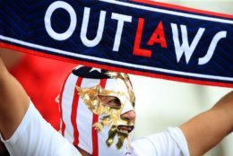 REIMS, FRANCE - JUNE 24: A USA fan wearing a mask shows their support prior to the 2019 FIFA Women's World Cup France Round Of 16 match between Spain and USA at Stade Auguste Delaune on June 24, 2019 in Reims, France. (Photo by Marc Atkins/Getty Images)