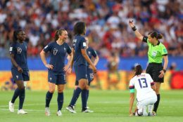PARIS, FRANCE - JUNE 28:  Referee Maryna Striletska talks to Griedge Mbock Bathy of France following a foul on Alex Morgan of USA during the 2019 FIFA Women's World Cup France Quarter Final match between France and USA at Parc des Princes on June 28, 2019 in Paris, France. (Photo by Richard Heathcote/Getty Images)