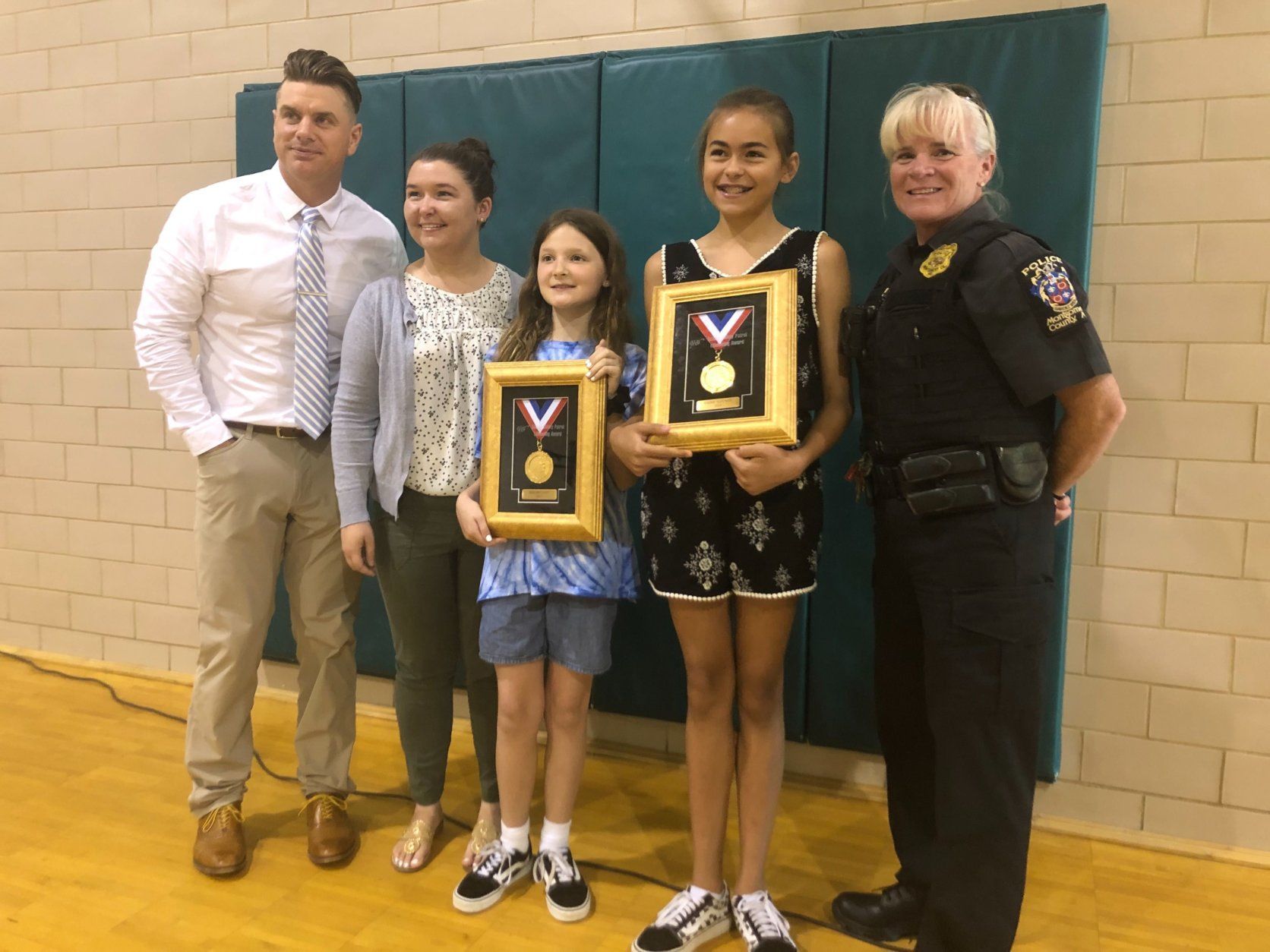 Their bravery was honored Tuesday with the highest school safety patrol honor, the Lifesaving Medal, presented by AAA. (WTOP/Melissa Howell)