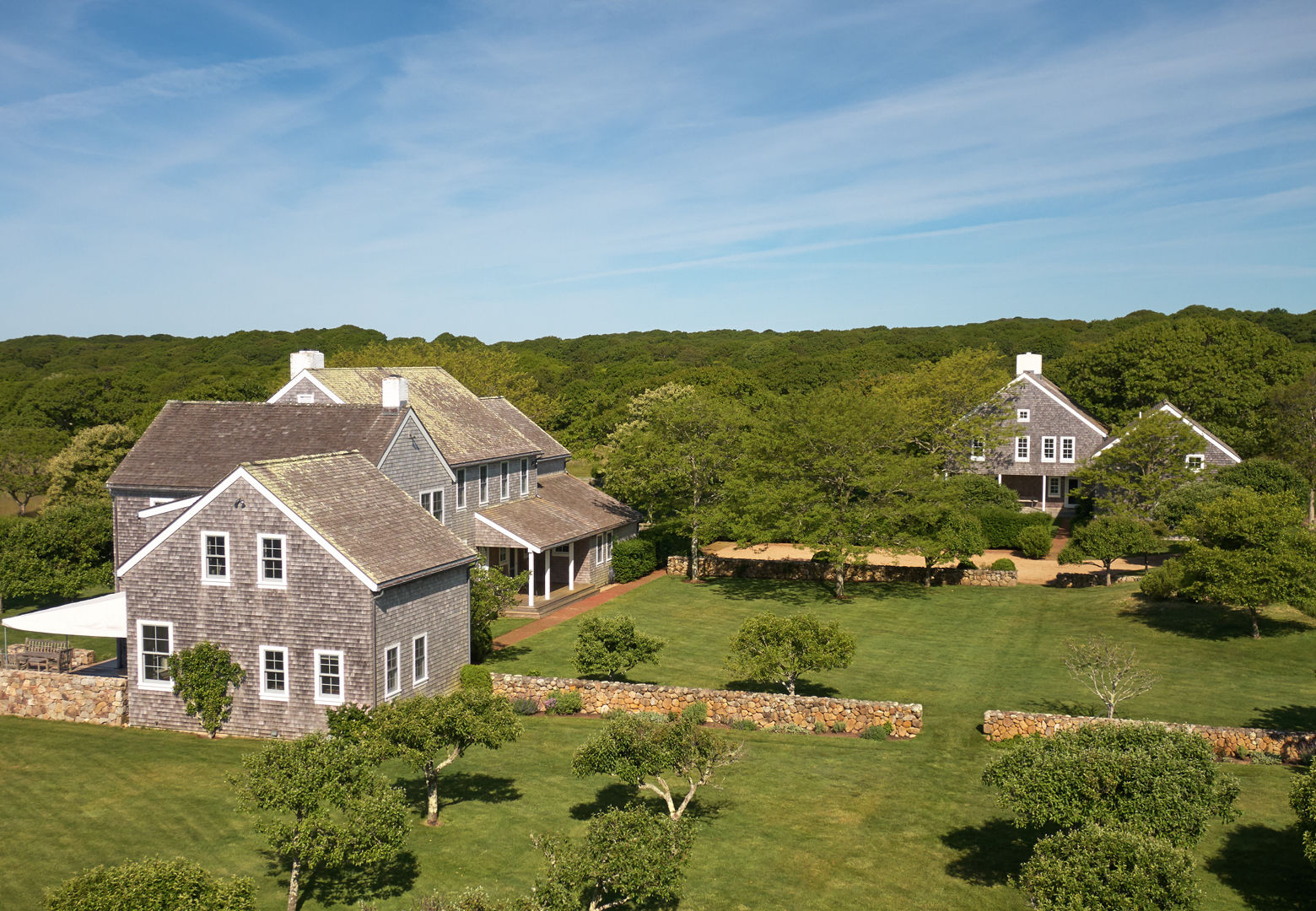 A two-story guest house has four bedrooms and three baths plus a living room, kitchen and laundry. Outbuildings include two garages, a caretaker’s house with three bedrooms, a boat house, a temperature- and humidity- controlled storage building, and a hunting cabin – the only structure when Mrs. Onassis purchased Red Gate Farm. (Laura Moss Photography)