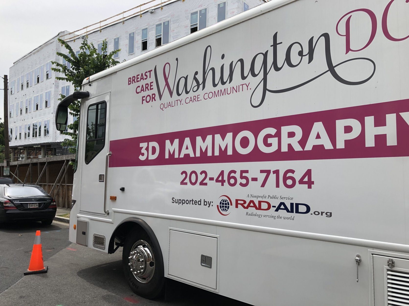 Breast Care for Washington, a group that aims to provide screening and care to underserved D.C. populations, rolled out the MobileMammo program at an event Wednesday. It will provide 3D mammograms aboard a 45-foot bus. (WTOP/Kristi King)