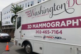 Breast Care for Washington, a group that aims to provide screening and care to underserved D.C. populations, rolled out the MobileMammo program at an event Wednesday. It will provide 3D mammograms aboard a 45-foot bus. (WTOP/Kristi King)