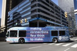 A Southeastern Pennsylvania Transportation Authority bus (SEPTA) turns onto Market Street in Philadelphia, Wednesday, May 2, 2018. Lawyers for an investigative reporting organization are suing Philadelphia's main transit agency after it refused to run ads about the group's stories on racial disparities in mortgage lending. (AP Photo/Matt Rourke)