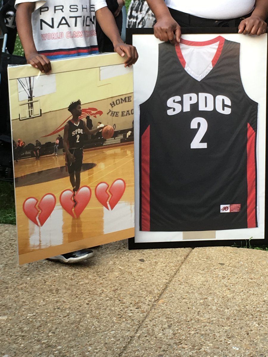 Scott's basketball jersey was framed and brought to the vigil. (WTOP/Liz Anderson)