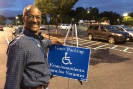 Precinct 223 chief Alex Turner was out in Reston early Tuesday morning. "All are welcome," he said. (WTOP/Kristi King)