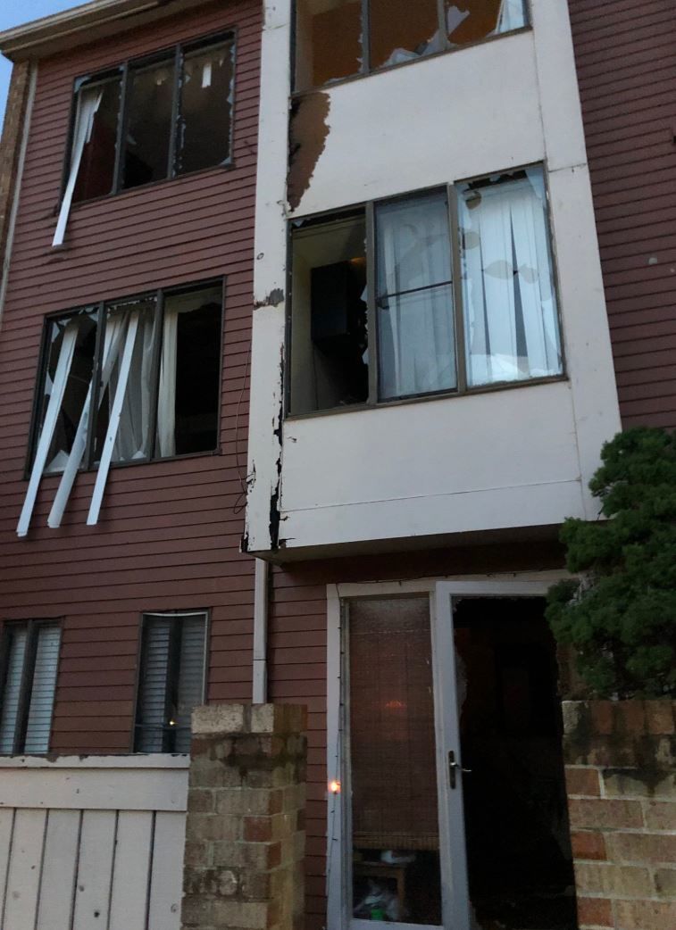 A water main break on Thursday, June 6, 2019, in Montgomery County, Maryland, damages windows of several town houses. (Courtesy Montgomery County Fire and Rescue Service)