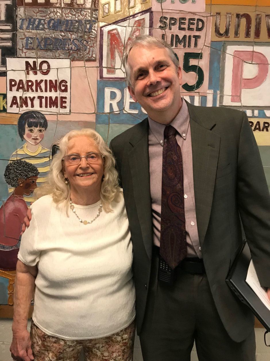 New Hampshire  Estates Elementary School principal Bob Geiger poses with teacher's aide Ginny Bumblis, who's retiring after 50 years. (WTOP/Dick Uliano)