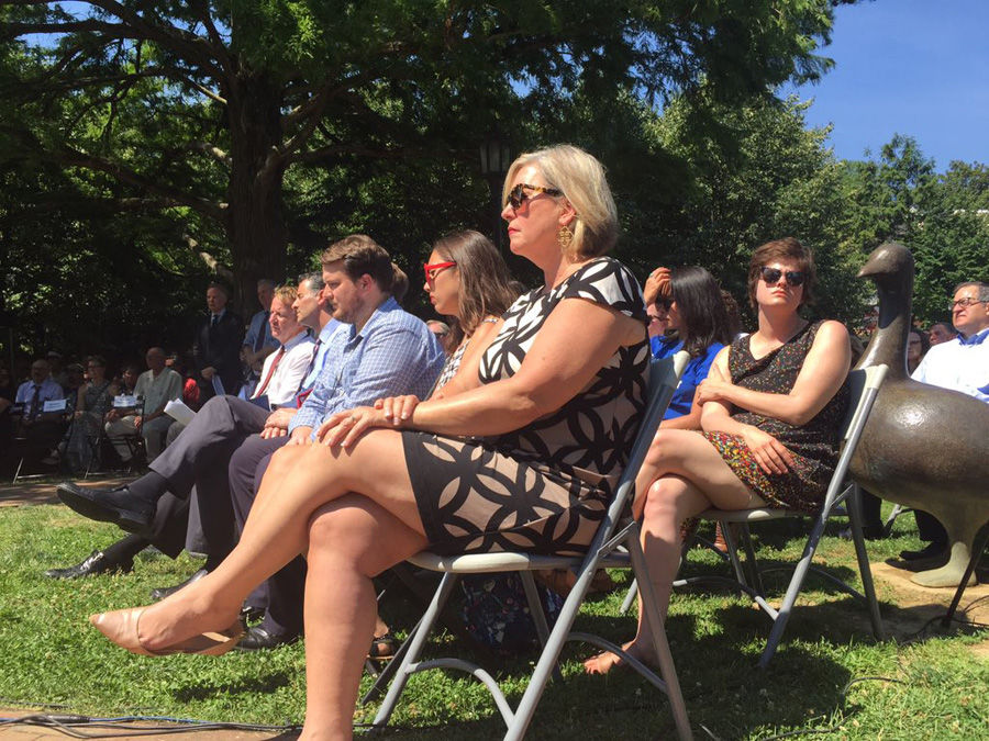 Under the summer sun, loved ones. colleagues and others gathered to honor the victims. (WTOP/John Domen)