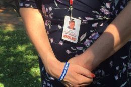 Andrea Chamblee wears her husband's favorite press pass every day. (WTOP/John Domen)