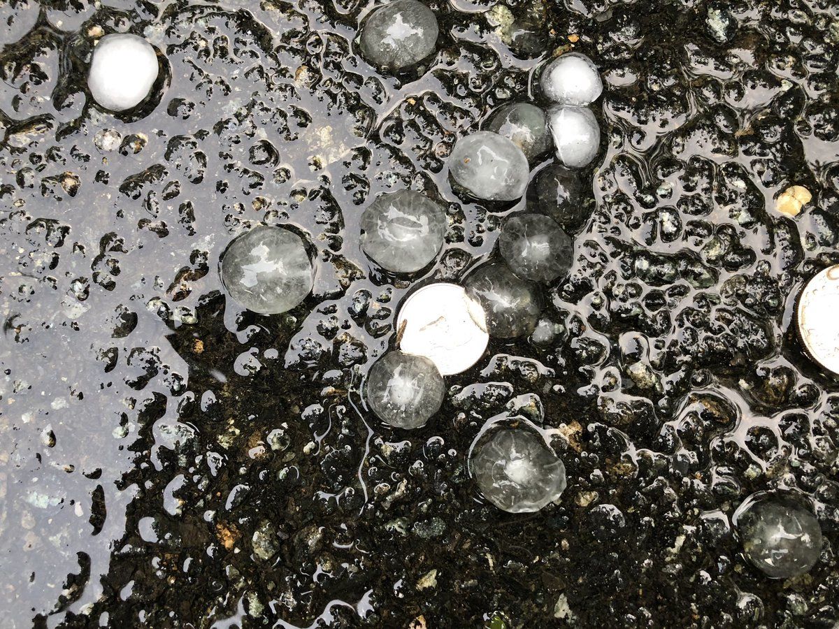 Quarter-sized hail is seen on MacArthur Boulevard near the Beltway on Sunday, June 2. (WTOP/Dave Dildine) 
