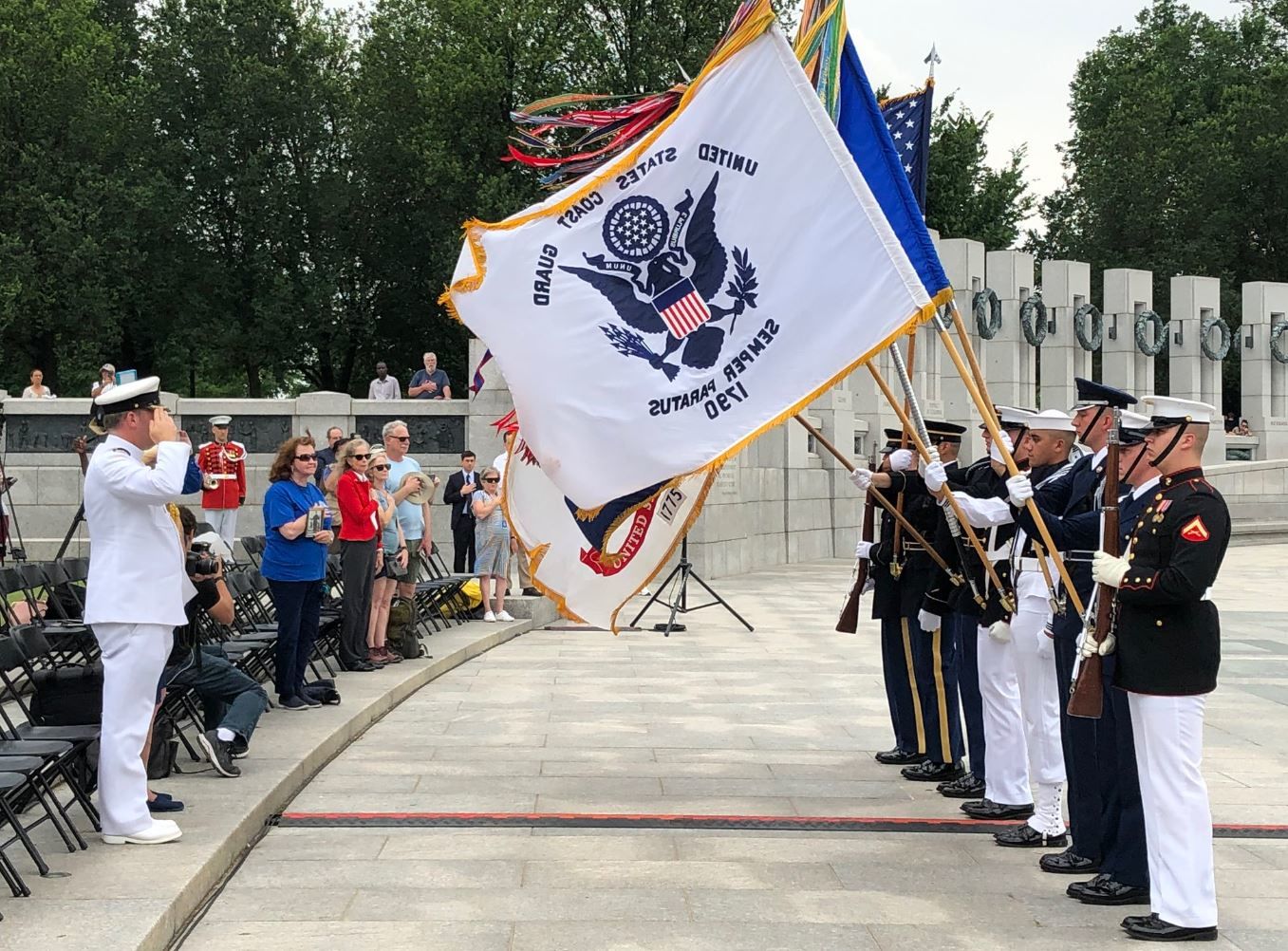 Volunteers took turns on Wednesday reading the names of some 9,000 service members who are buried at Normandy American Cemetery in France. (WTOP/Michelle Basch)