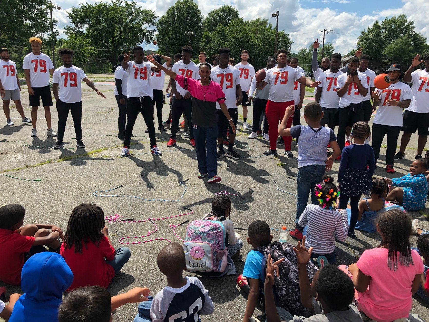 University of Maryland football players and J.C. Nalle Elementary students spend time to honor Jordan McNair. (WTOP/Michelle Basch)