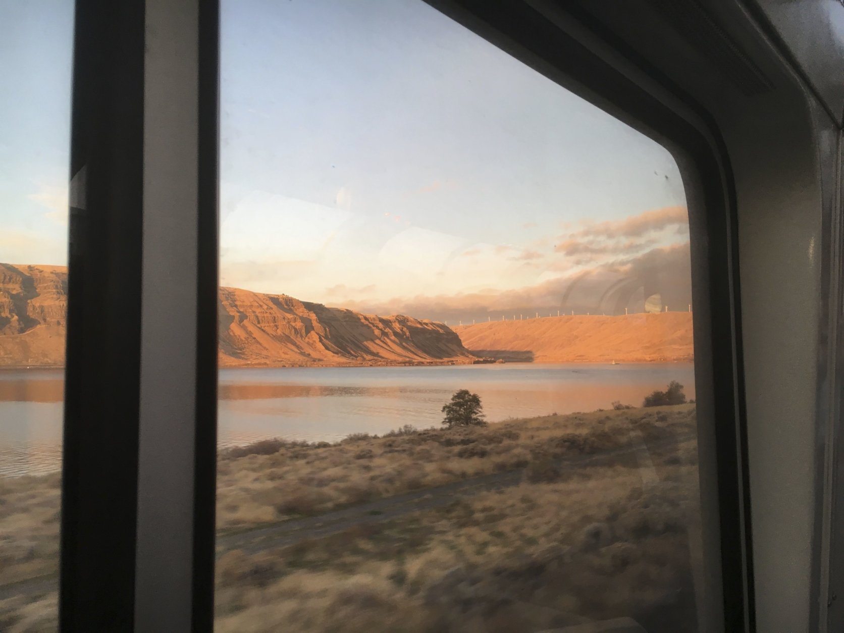 In this Nov. 14, 2017 photo Amtrak's Empire Builder approaches a bend in the Columbia River Gorge. The Empire Builder's section serving Portland, Oregon, travels approximately 55 miles of the gorge, which separates Oregon and Washington. Further east, the train crosses the northern Rockies and the northern Great Plains on its route between Chicago and the Pacific Northwest. (AP Photo/Paul Davenport)