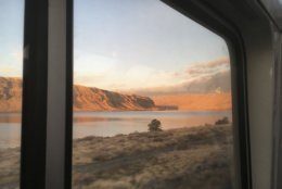 In this Nov. 14, 2017 photo Amtrak's Empire Builder approaches a bend in the Columbia River Gorge. The Empire Builder's section serving Portland, Oregon, travels approximately 55 miles of the gorge, which separates Oregon and Washington. Further east, the train crosses the northern Rockies and the northern Great Plains on its route between Chicago and the Pacific Northwest. (AP Photo/Paul Davenport)