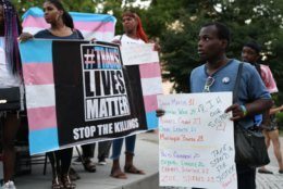 Supporters chant "Trans lives matter" during a vigil on Friday, June 21, 2019 in Dupont Circle. (WTOP/Alejandro Alvarez)