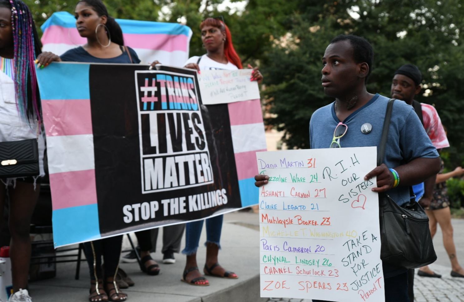 Supporters chant "Trans lives matter" during a vigil on Friday, June 21, 2019 in Dupont Circle. (WTOP/Alejandro Alvarez)