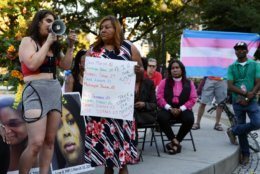 On Friday, June 21, 2019, a speaker recounts her experience with violence as a member of the LGBTQ community. (WTOP/Alejandro Alvarez)