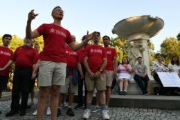 The Gay Men's Chorus of Washington performs during a vigil in Dupont Circle on Friday, June 21. 2019. (WTOP/Alejandro Alvarez)