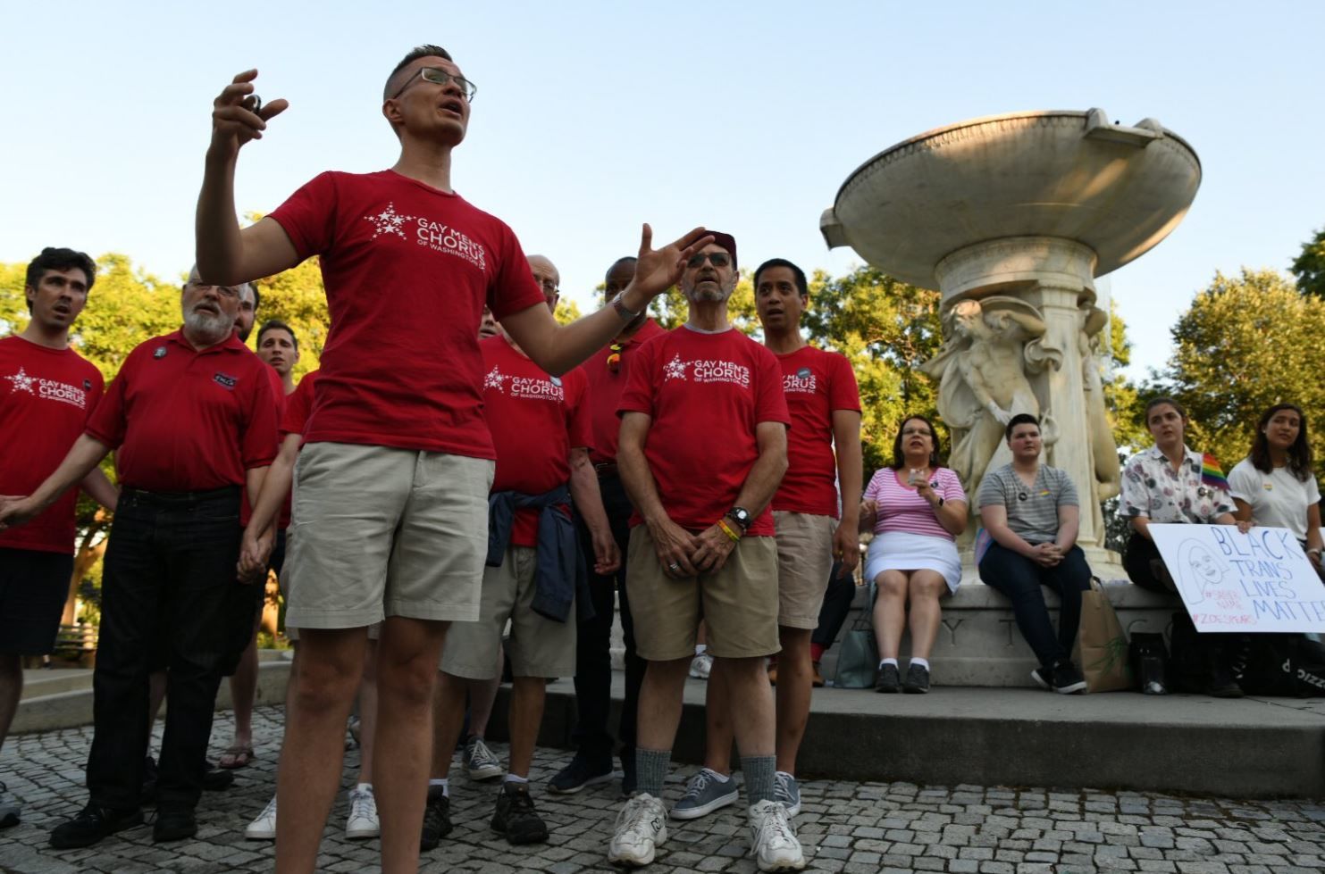 The Gay Men's Chorus of Washington performs during a vigil in Dupont Circle on Friday, June 21. 2019. (WTOP/Alejandro Alvarez)