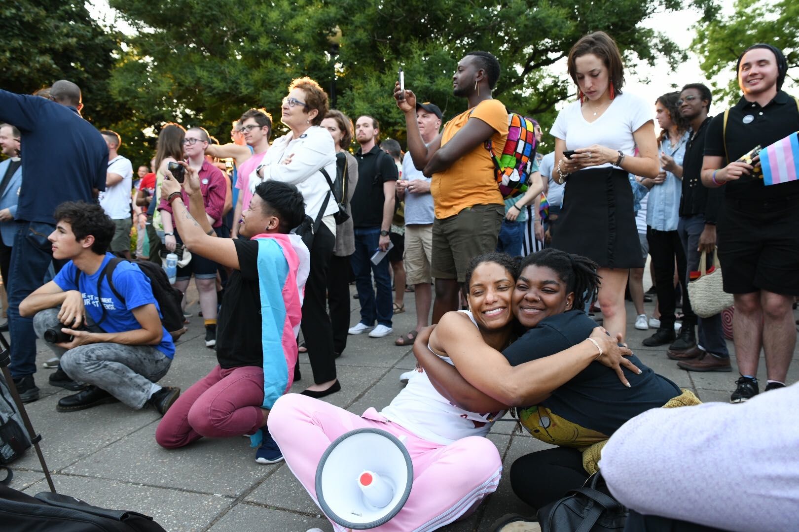 In the wake of recent violence against the LGBTQ community in the D.C. area, including the killing of two transgender women, supporters gathered in Dupont Circle Friday night for a vigil. (WTOP/Alejandro Alvarez)