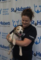 St. Hubert's Animal Welfare staff holding dog