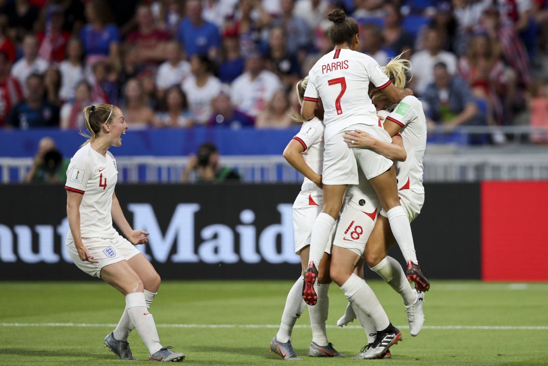 England players celebrate after scoring against United States during the Women's World Cup semifinal soccer match at the Stade de Lyon outside Lyon, France, Tuesday, July 2, 2019. (AP Photo/Francisco Seco)