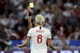 Brazilian referee Edina Alves Batista shows a second yellow card to England's Millie Bright during the Women's World Cup semifinal soccer match between England and the United States, at the Stade de Lyon outside Lyon, France, Tuesday, July 2, 2019. (AP Photo/Francisco Seco)