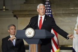 Vice President Mike Pence speaks at a naturalization ceremony for new naturalized citizens in celebration of Independence Day at the National Archives in Washington, Thursday, July 4, 2019. Also at the event is Acting Director, US Immigration and Immigration Services, Kenneth T. Cuccinelli, left seated. (AP Photo/Pablo Martinez Monsivais)