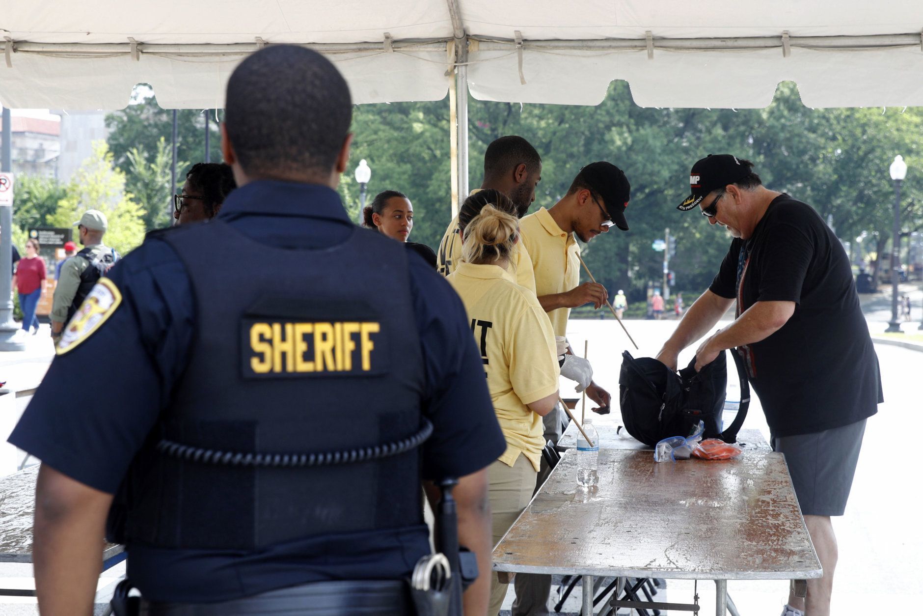 Security guards check bags at a checkpoint before Independence Day celebrations, Thursday, July 4, 2019, on the National Mall in Washington. (AP Photo/Patrick Semansky)
