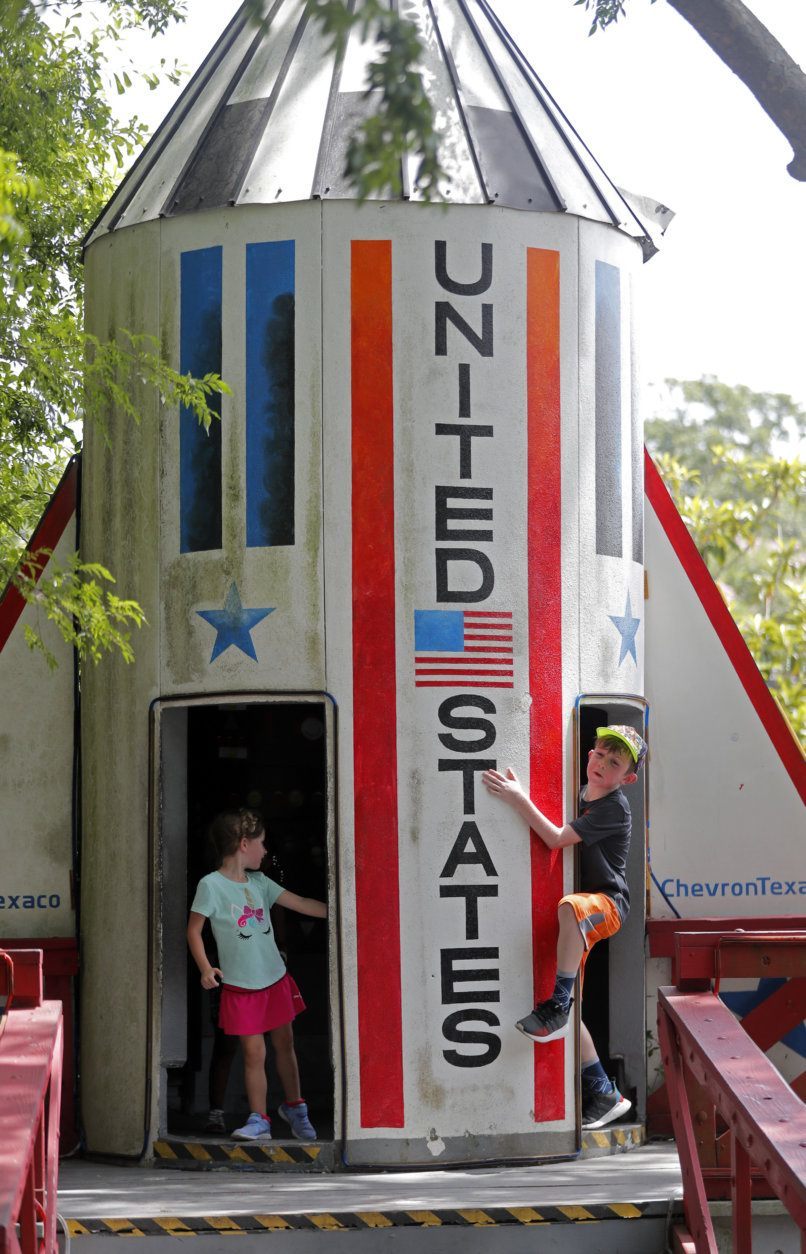 Lylah McKeehan, 4, left, plays with her brother Aiden McKeehan, 8, at Storyland, a children's playground, in City Park in New Orleans, Thursday, July 4, 2019. The 60-year-old playground is getting its first makeover in 35 years: four new exhibits and updates to those already there.(AP Photo/Gerald Herbert)